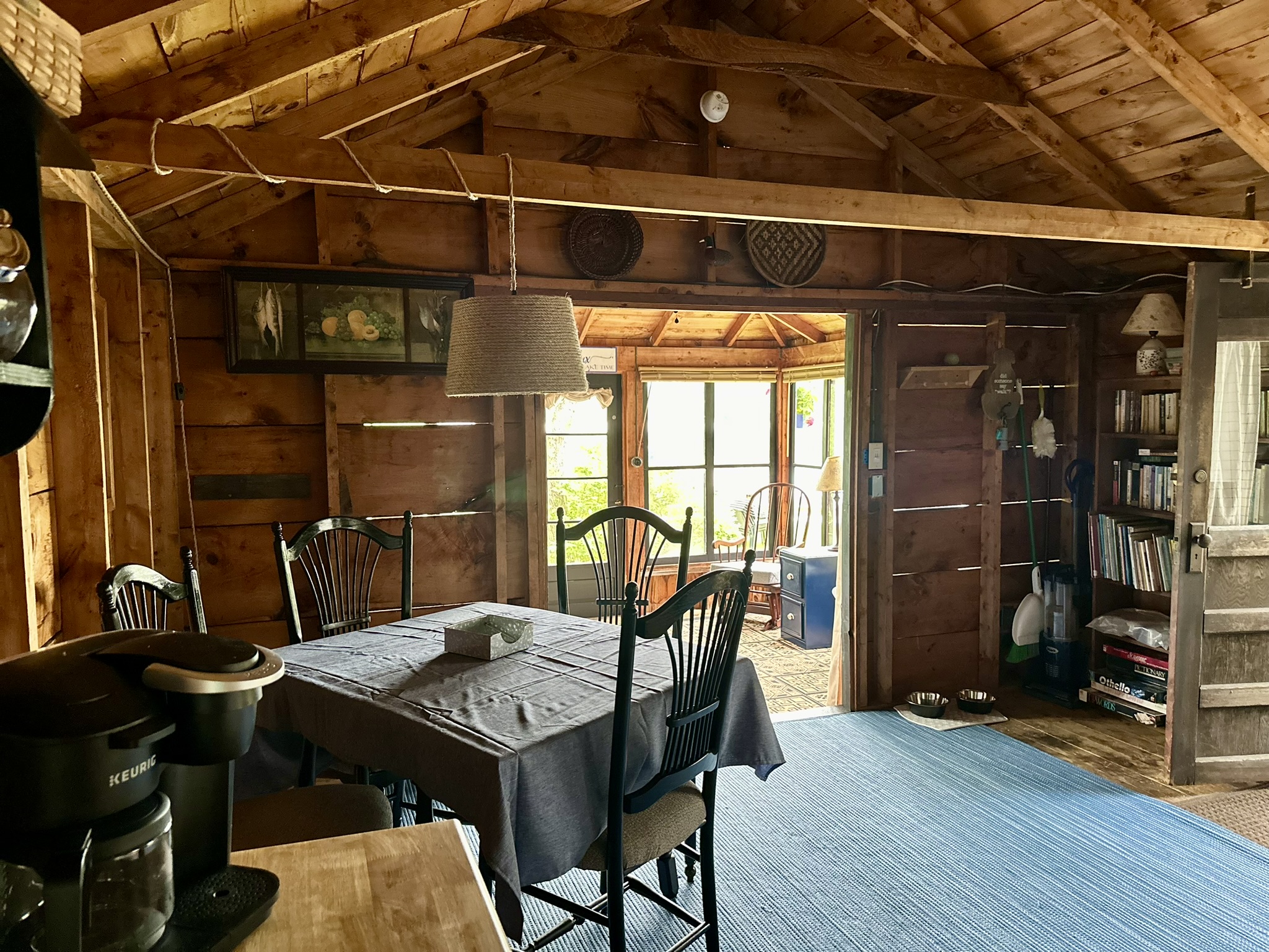 The dining room contains the kitchen, dining table and coffee station